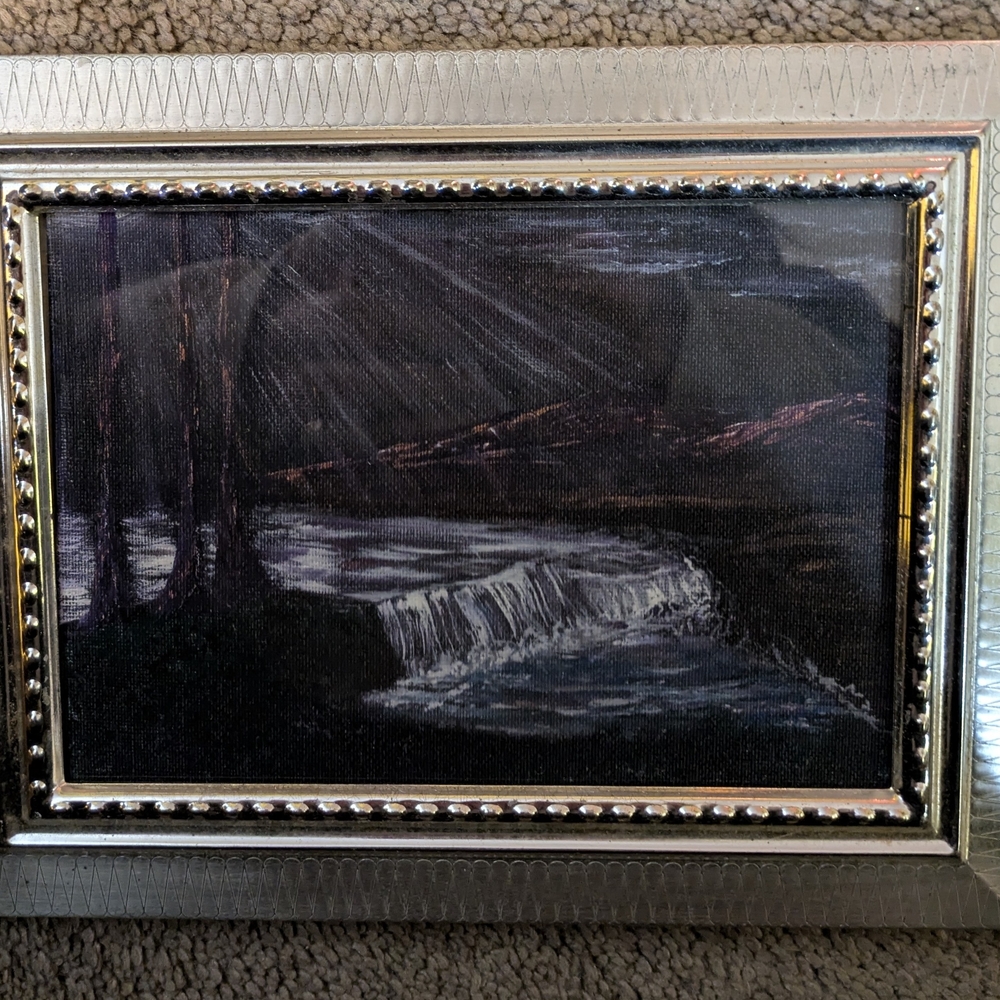 Elegant Silver Framed Art with Black and Gray Tones